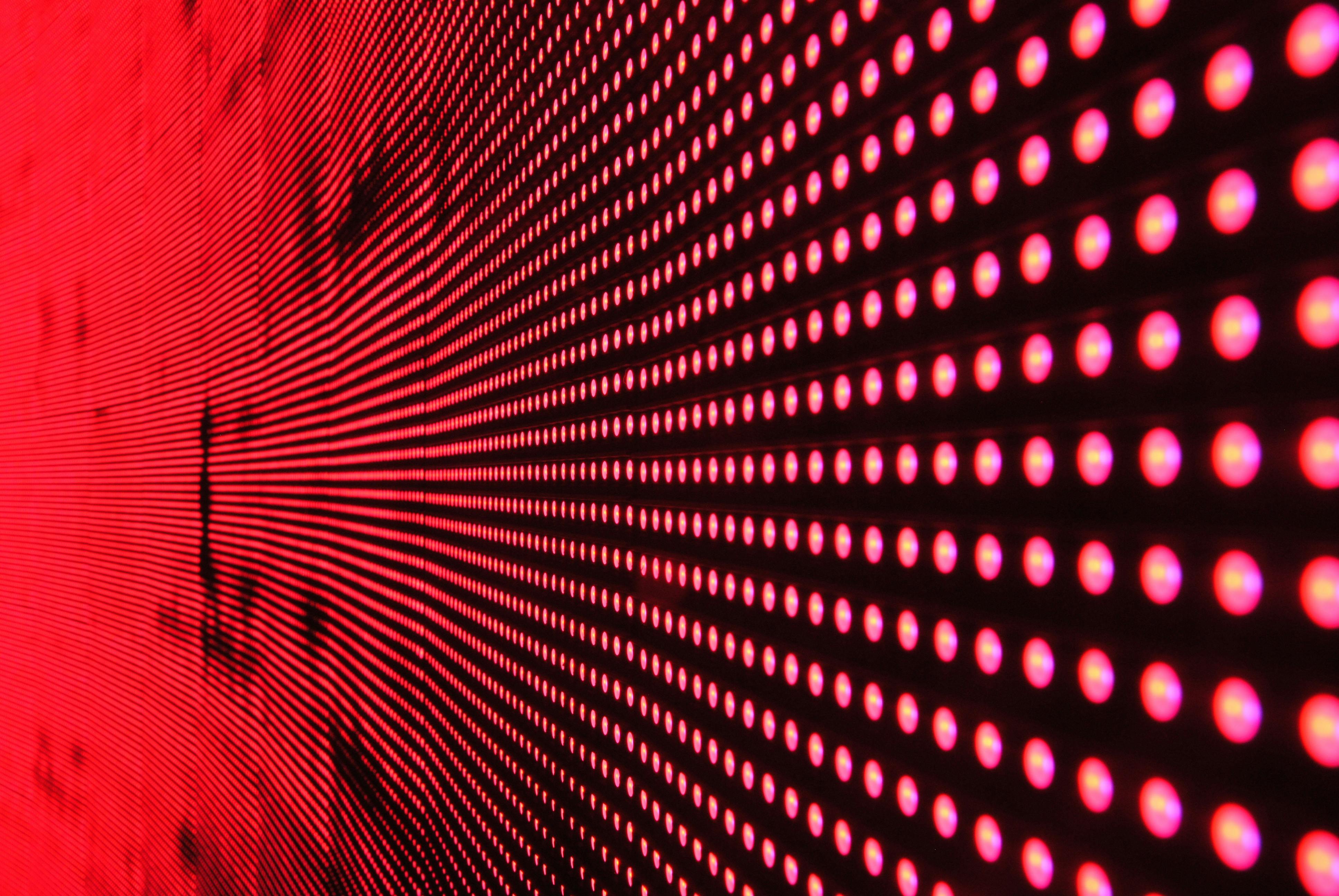 Person wearing a virtual reality headset in a blue-lit room