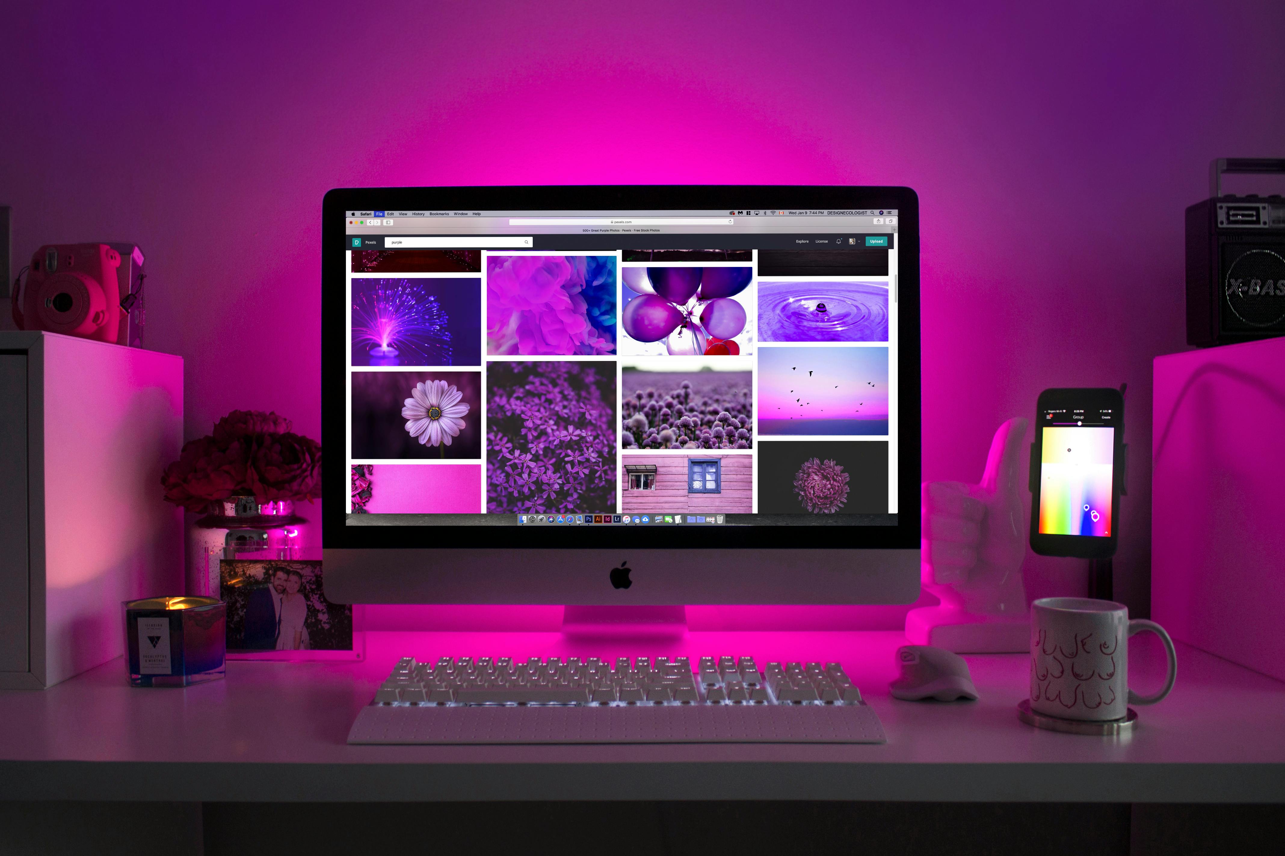 Person in vibrant neon lighting with abstract shapes